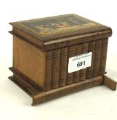 A 20th century continental olive wood puzzle box, in the form of nine books stacked on a shelf, 8.
