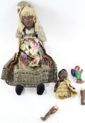 Three 20th century dolls, the larger example with plaster face and hands,