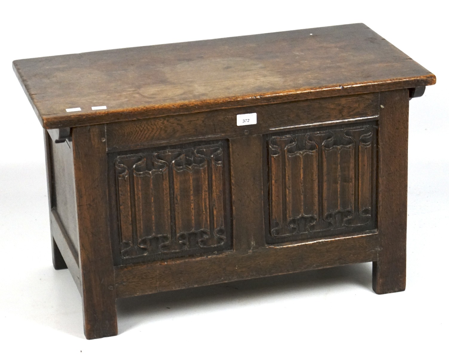 An early 20th century carved oak coffer, with Art Nouveau style decoration to the front,