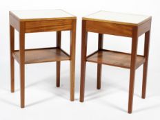 A pair of Formica topped teak bedside two tier tables with single drawer. 60cm x 29cm.