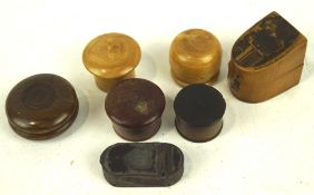 A collection of treen boxes, of assorted shapes and designs, some featuring turned details,