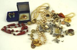 An assortment of vintage costume jewellery, including earrings,