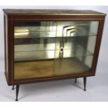 A mid- 20th century glazed cabinet,
