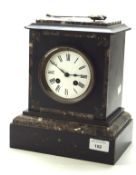 A late 19th/early 20th century striking slate mantle clock, the case with inlaid marble detailing,