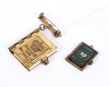 Two commemorative charm pendants books,