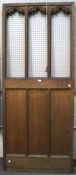 A large internal oak partition with three open sections to the upper half,