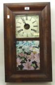 A Victorian wall clock, the painted enamel dial with Roman numerals and floral details,