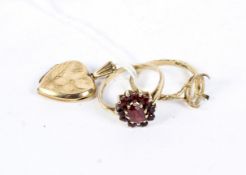 A 9ct gold cluster ring set with red stones, together with a 9ct gold ring shaft and a heart locket,