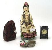 Four oriental and chinoiserie collectables, including a ceramic figure in a seated pose,