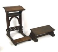 Two oak kneelers, one with book slope and hinged kneeler, pierced with quatrefoil motifs,