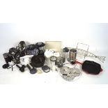 A large box of kitchen equipment, including mixers, a fish cooker, measuring jugs,