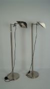 Two modern chrome floor lamps with shaped shades, height 116cm,