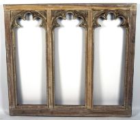 A large carved and pierced white painted piece wall piece comprising three archways,