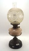 An early 20th century Duplex oil lamp, the glass reservoir decorated with fruit and vine scenes,