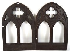 A pair of window arches, likley from a church, both with carved and pierced decoration, 90.5cm x 60.