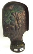 A copper Arts and Crafts candle holder, embossed with an image of a tree,