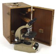 A mid century Vickers instruments microscope with two lenses,