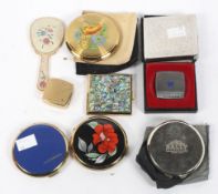 A collection of compacts, of circular and square form, some with mother of pearl decoration,