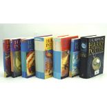 Seven Harry Potter books, hard and soft back, various editions.