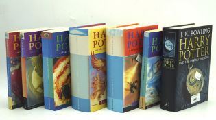 Seven Harry Potter books, hard and soft back, various editions.