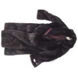 A vintage black fur coat by M & Michaels Furs of Bristol,