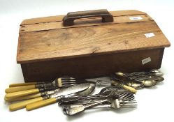An oak and elm cutlery box containing flatware,