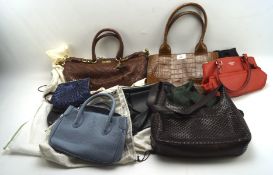 A selection of ladies' designer handbags, including examples by Coach, Liola,