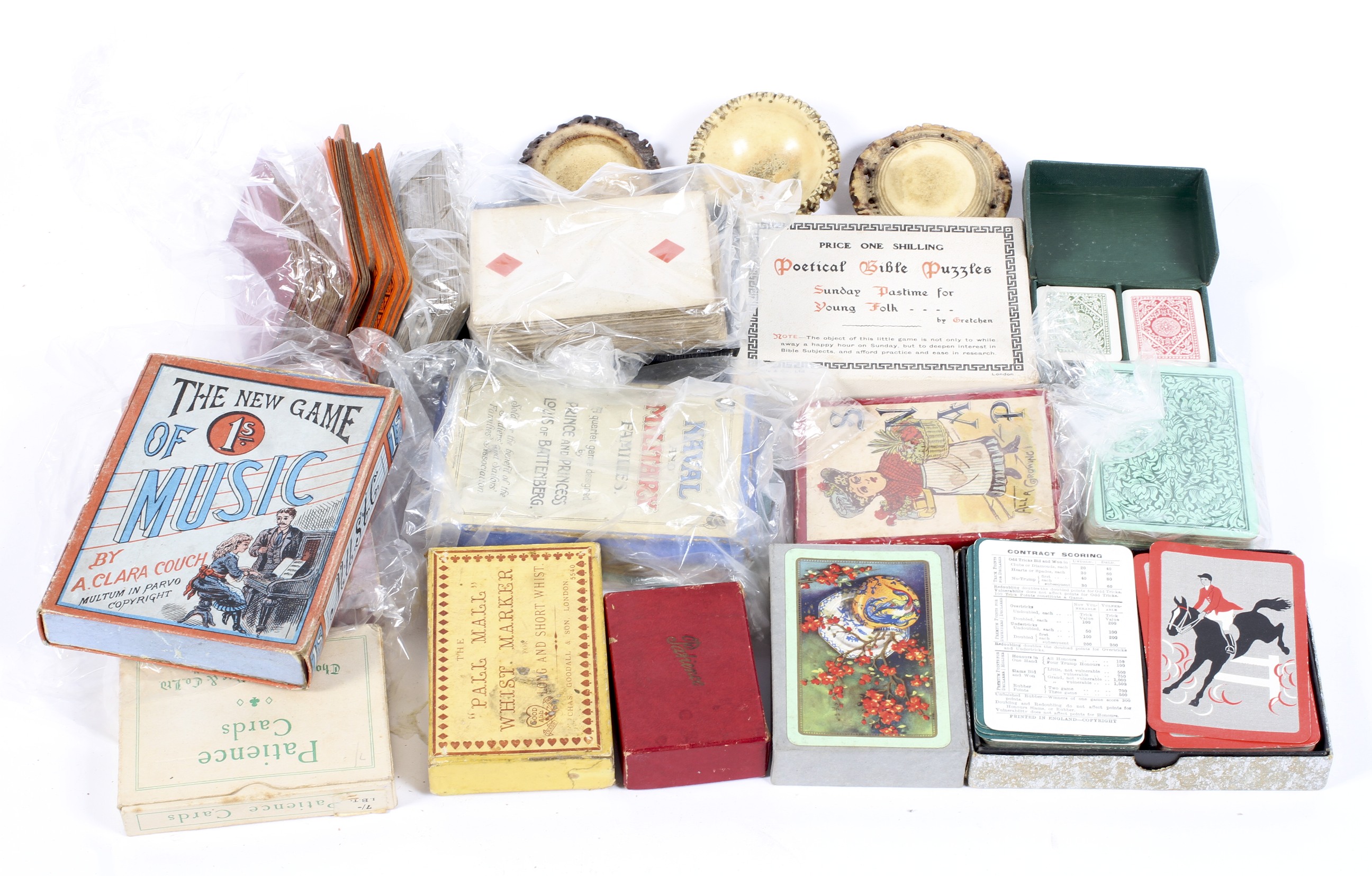 An assortment of vintage cards and games, to include playing cards,