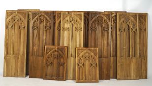 Thirteen carved wooden arches, likely from a church or religious building,