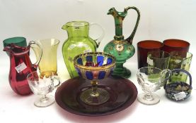 An assortment of coloured glassware,