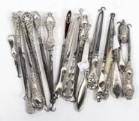 A collection of silver handled button hooks, of assorted sizes and designs,