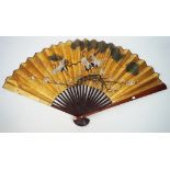 A contemporary Chinese folding fan, the paper leaf decorated with herons on a gold ground,