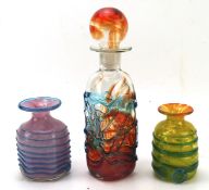 Three pieces of Mdina glassware, including a decanter and two vases,