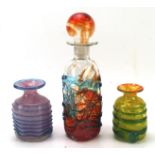 Three pieces of Mdina glassware, including a decanter and two vases,