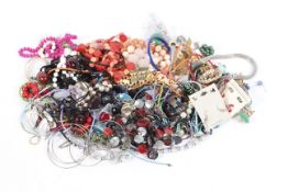 A collection of costume jewellery, including pendants, beaded necklaces, white metal bracelets,