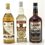 Three vintage bottles of alcohol, including a bottle of Pierre Smirnoff vodka,