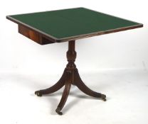 A late 19th century mahogany folding card table,