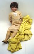 An Arthur Schoenau & Hoffmeister bisque head girl doll, with sleeping brown eyes, open mouth,