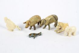 Six late 19th-early 20th century carved ivory or papier mache animals, including an ivory elephant,
