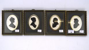 Four 20th century Penny Farthing silhouettes, featuring two women and two gentlemen,