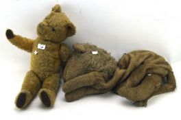 A 20th century teddy bear and pyjama case,