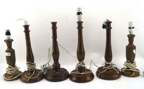Six turned wooden lamp bases,