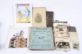 An assortment of postcards, scrap books and music books, the majority featuring botanical images,