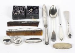 An assortment of silver and plated wares, including a large Georgian spoon,