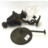 A Victorian brass wall mounted oil lamp, the adjustable frame featuring a dragon,