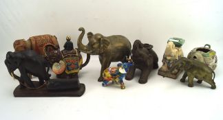 A collection of assorted figures of elephants,