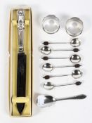 A selection of silver flatware, including napkin rings, a set of six teaspoons,