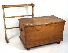 A late 19th century pine storage trunk and a pine clothes stand,