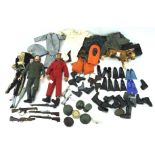 Two vintage Action Man figures and an assortment of clothing and accessories, including a dog,