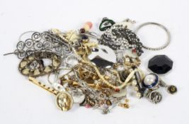 A collection of costume jewellery, including charms, a bangle, bracelets,